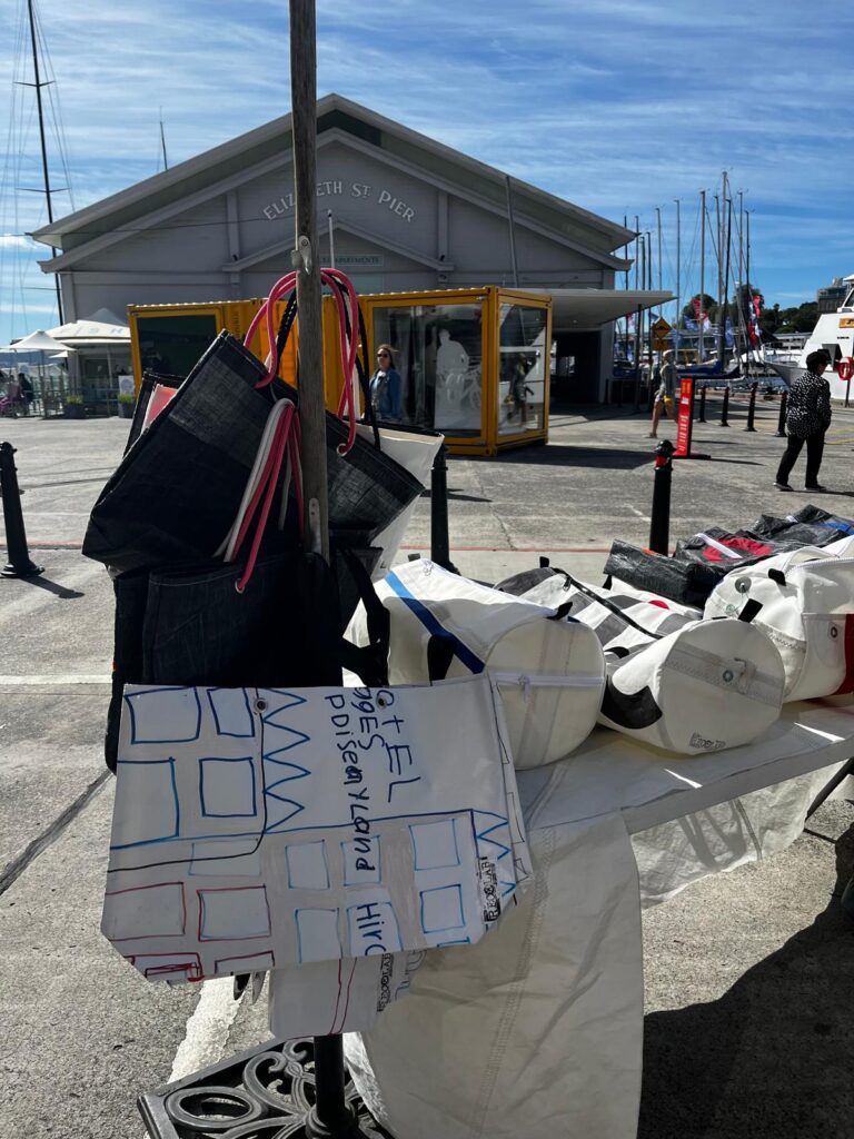 7. Involve Local Organizations<br>We collaborated with Recolab, a local Hobart small business that collects sailcloth and creates usable bags. She was there to sell her product and engage with visitors and sailors about reducing sailing associated waste materials, and collect sailcloth from our fleet as well as the fleet from boats in the other Hobart ocean races occurring at the same time. Feedback we received from Lyn, the woman behind the business, was that her time in our village was her best for sales in a single day since starting her business, we were delighted to have supported this. She not only attracts visitors and customers from our event, but also from those attending the Sydney to Hobart event too. 