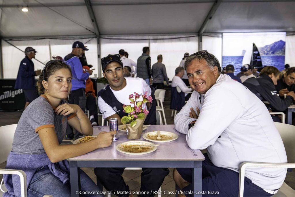 17. Offer Vegetarian or Vegan Alternatives<br>During the RS21 World Championship racing days (from September 23 to 28) we ensured that vegetarian and vegan alternatives were available to all participants.

Daily Meals: From September 23 to 28, meals were served to the sailors after the races. Apart from the special events on the 23rd (inauguration), the 26th (crew dinner), and the 28th (closing ceremony), a pasta dish was provided daily with two options: one vegan and one containing either meat or fish.

Inauguration (September 23): The inauguration event featured a variety of appetizers. Vegan and vegetarian options included olives, cheese, and Spanish omelette.

Crew Dinner (September 26): The crew dinner consisted of a seafood rice dish. The meal began with a comprehensive selection of appetizers, including: potato salad salad bowl, gazpacho (cold tomato soup) shots, guacamole with chips and hummus.