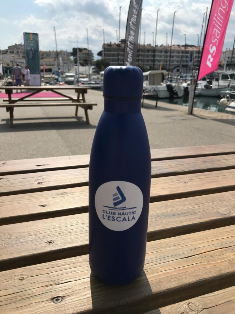 1. Eliminate Single-Use Water Bottles and Provide Water Refill Stations<br>During the 2024 RS21 World Championship, the regatta organizers did not distribute single-use water bottles to either staff or participants. Instead, two water refill stations were installed, allowing everyone to fill their own reusable bottles. For those who did not bring a bottle, reusable bottles were available for purchase at the regatta office.

The policy of not using plastic bottles and the available alternatives were communicated to participants through a pre-regatta informational email, the regatta website, and the Whatsapp channel during the event.

At the regatta events, including the opening ceremony, cocktail party, and awards ceremony, beverages were served in glass containers and either glassware or recyclable cardboard cups were used.