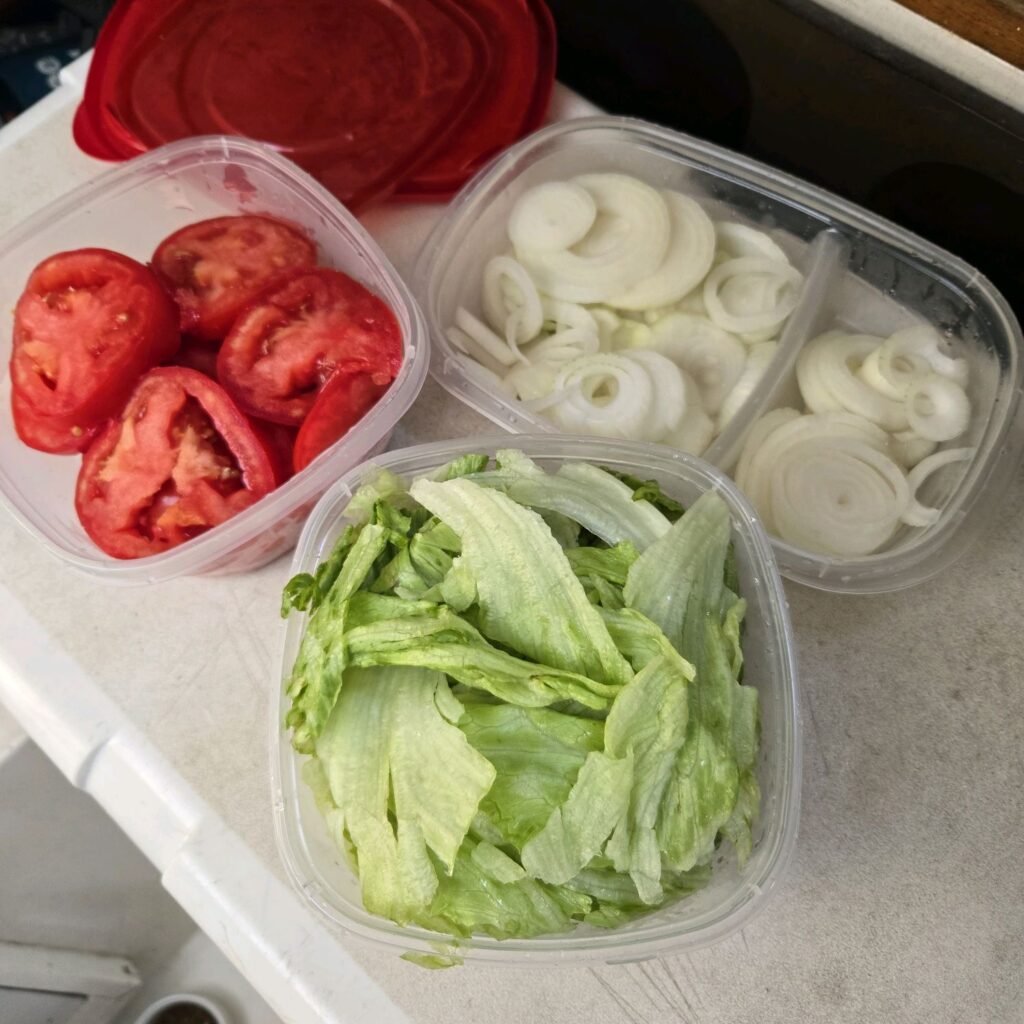 9. Serve Local Food or Source Seafood Sustainably<br>Our non-racing members provide a potluck style meal for our guests. We do our best to encourage local, so one member made sure to bring lettuce, tomatoes and onions (for the burgers) bought from our local produce market! I
