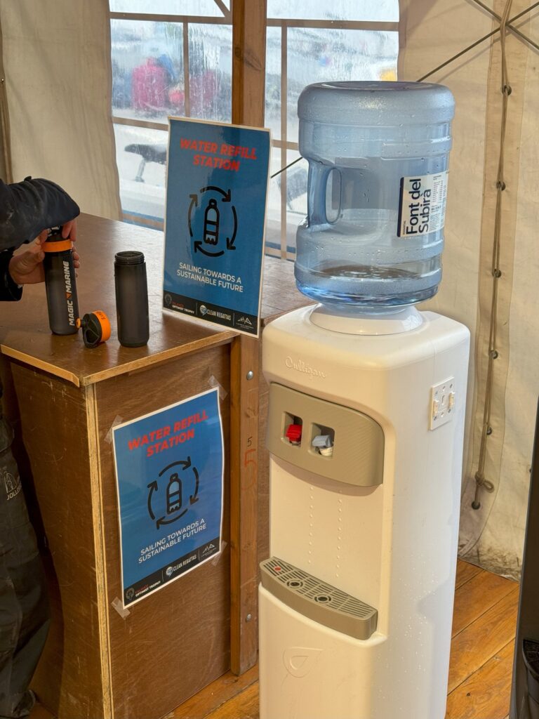 1. Eliminate Single-Use Water Bottles and Provide Water Refill Stations<br>The regatta organisers provide water refill stations for all sailors, coaches and members of the organisation. Water refill stations are located in the beach hospitality tent and the Club area near the Race Committee and Coach boats