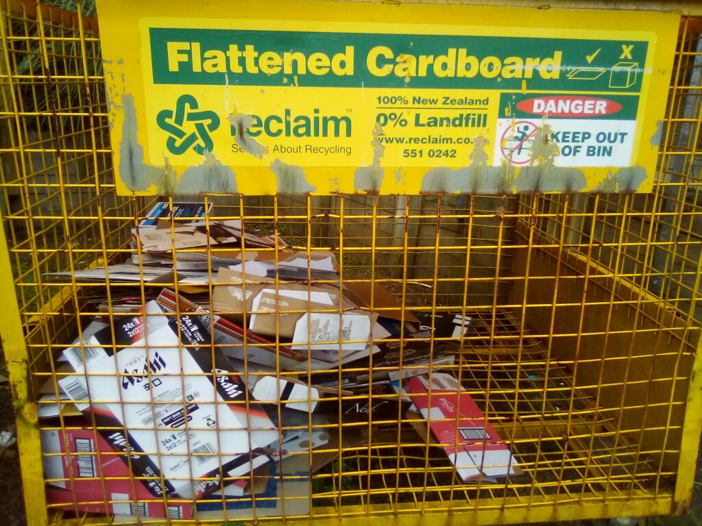 11. Ensure Proper Waste Bin Placement and Signage<br>11. Cardboard boxes housing beverages, food, and supplies were flattened and placed in a designated reclamation bin. (Photo 11a) Smaller WOWW-specific waste bins were created and placed in appropriately-marked baskets in more than one location for transfer to bigger bins for waste management pick up. (Photo 11b) Bottle caps were sorted in the kitchen and at the bar for club recycling or local school fundraising. (Photo 11c)  