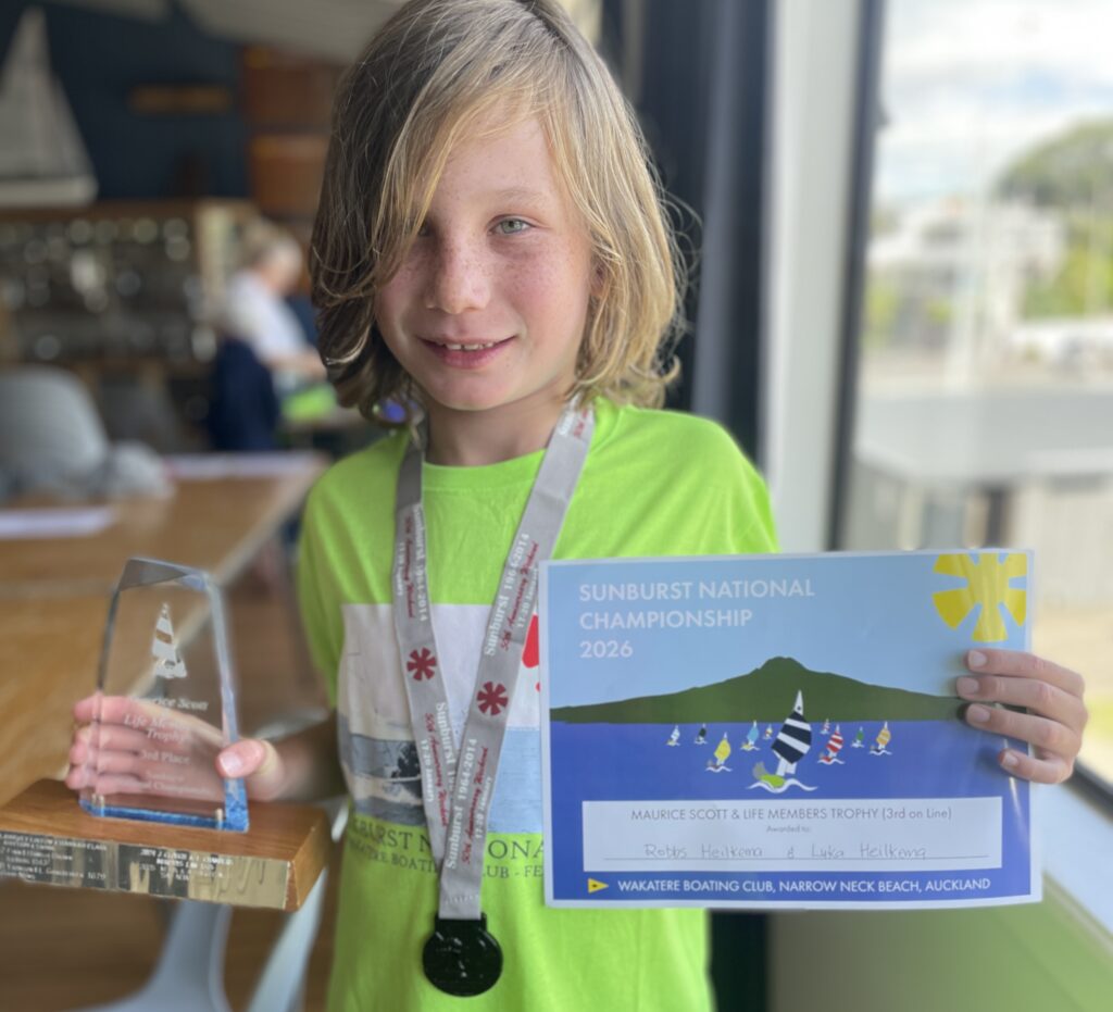 5. Award Practical Items or Use a Perpetual or Upcycled Trophy<br>There are several ways we did this and aimed to keep it fun and meaningful. A duck is handed out every year to someone with a funny story from the regatta. There was also a special painting which was awarded to the winners of the invitation race. 
Medals from the previous sunburst nationals which were held at Wakatere (in 2017) which had been sitting in cupboards were handed to the young competitors, along with leftover T-shirts. This meant no new t-shirts were being made, and instead we were recycling existing stock. 
Plenty of hats for all competitors too - vital for sailors! 