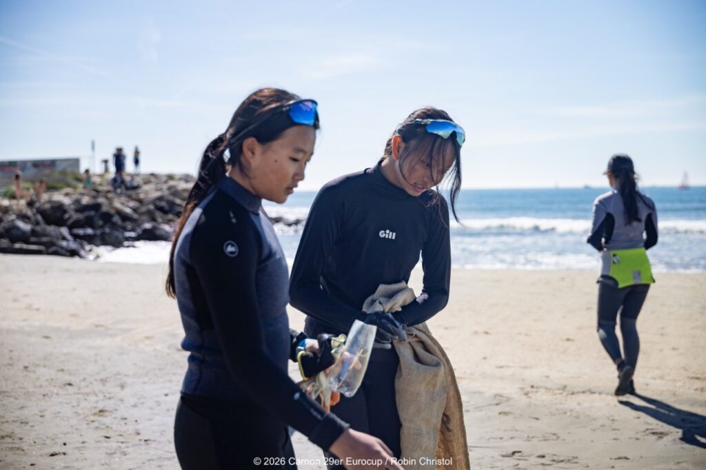 14. Host a Beach or Marina Cleanup<br>14 - We organized a beach clean-up with Ocean Protection France, involving volunteers and members of the public outside the regatta.
We also organized a dedicated clean-up action with the young sailors during a no-wind break. This was a great success and created a strong collective moment.
Initially, we had planned to let sailors join the Green Brigade at any time during the weekend, take part in a beach clean-up, and enter a photo contest. However, this format proved difficult to combine with the rhythm and timing of the races.
We are now looking for new and innovative ideas for next year to further involve young sailors in environmental action during the event.
