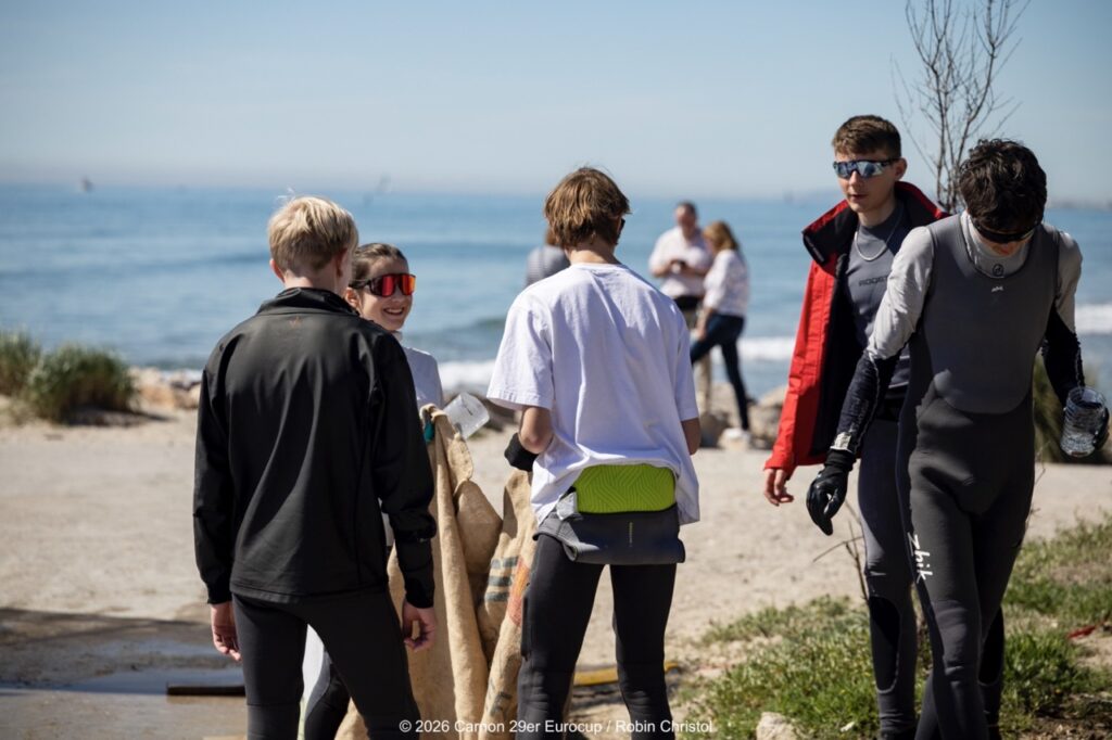 14. Host a Beach or Marina Cleanup<br>14 - We organized a beach clean-up with Ocean Protection France, involving volunteers and members of the public outside the regatta.
We also organized a dedicated clean-up action with the young sailors during a no-wind break. This was a great success and created a strong collective moment.
Initially, we had planned to let sailors join the Green Brigade at any time during the weekend, take part in a beach clean-up, and enter a photo contest. However, this format proved difficult to combine with the rhythm and timing of the races.
We are now looking for new and innovative ideas for next year to further involve young sailors in environmental action during the event.
