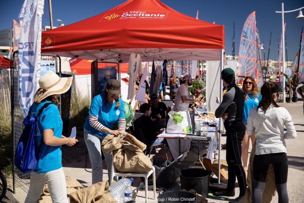 7. Involve Local Organizations<br>7 -  During the event, we brought together several local organizations committed to environmental protection and circular economy.

Ocean Protection France was involved in public awareness activities, as well as beach and regatta site clean-up actions. Ailerons helped raise awareness about the presence of rays and sharks in the Mediterranean Sea, while also developing the BioLit citizen science observation program. Lezprit Réquipe also took part in the event, promoting the collection, repair and reuse of sports equipment, including nautical gear, and offering neoprene wetsuit repairs.
All these initiatives and partner organizations were presented on the event website: www.eurocup-29er-carnon.com
We also conducted several interviews on these topics to highlight the environmental and social responsibility actions implemented during the regatta.
