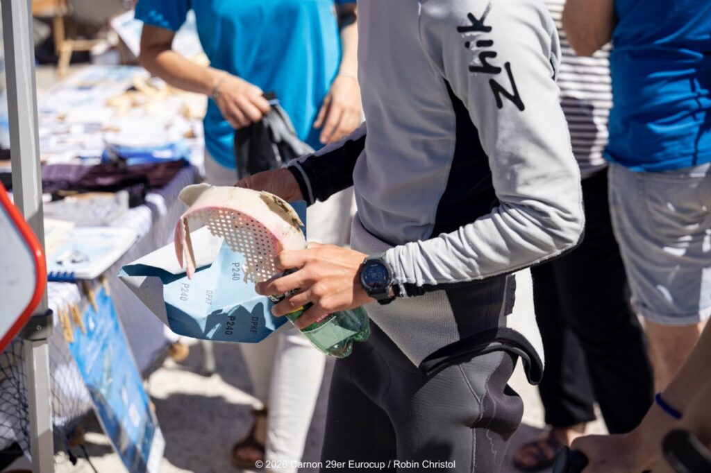 14. Host a Beach or Marina Cleanup<br>14 - We organized a beach clean-up with Ocean Protection France, involving volunteers and members of the public outside the regatta.
We also organized a dedicated clean-up action with the young sailors during a no-wind break. This was a great success and created a strong collective moment.
Initially, we had planned to let sailors join the Green Brigade at any time during the weekend, take part in a beach clean-up, and enter a photo contest. However, this format proved difficult to combine with the rhythm and timing of the races.
We are now looking for new and innovative ideas for next year to further involve young sailors in environmental action during the event.
