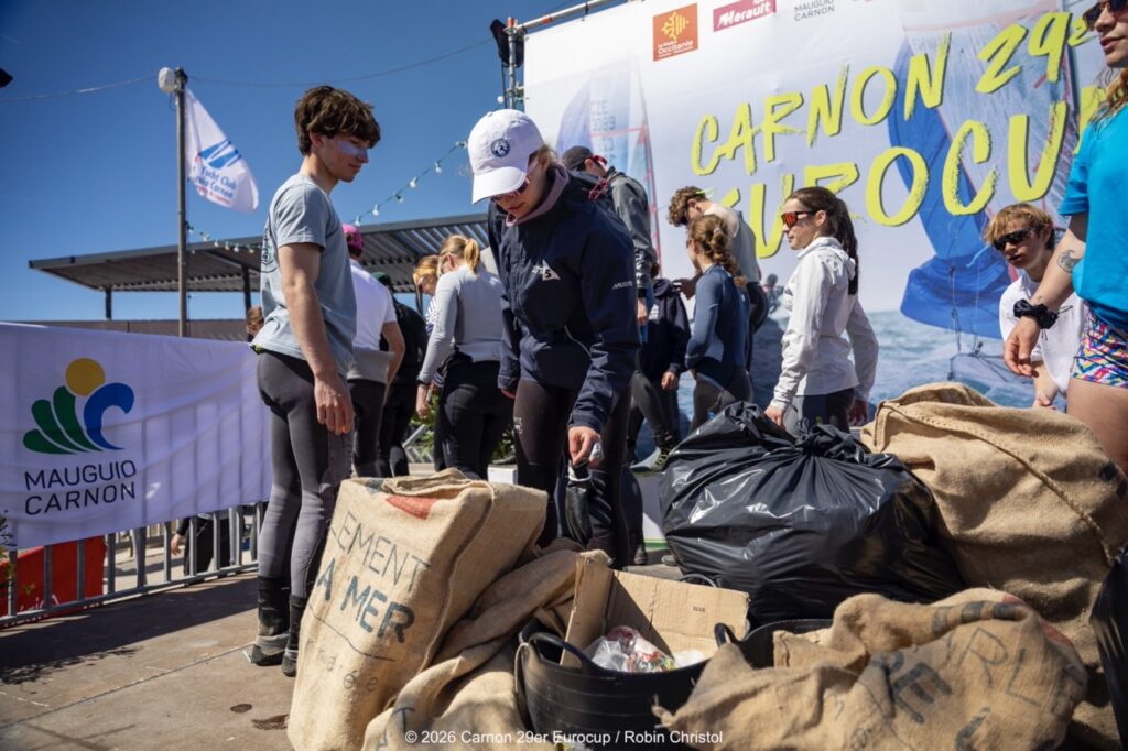 14. Host a Beach or Marina Cleanup<br>14 - We organized a beach clean-up with Ocean Protection France, involving volunteers and members of the public outside the regatta.
We also organized a dedicated clean-up action with the young sailors during a no-wind break. This was a great success and created a strong collective moment.
Initially, we had planned to let sailors join the Green Brigade at any time during the weekend, take part in a beach clean-up, and enter a photo contest. However, this format proved difficult to combine with the rhythm and timing of the races.
We are now looking for new and innovative ideas for next year to further involve young sailors in environmental action during the event.
