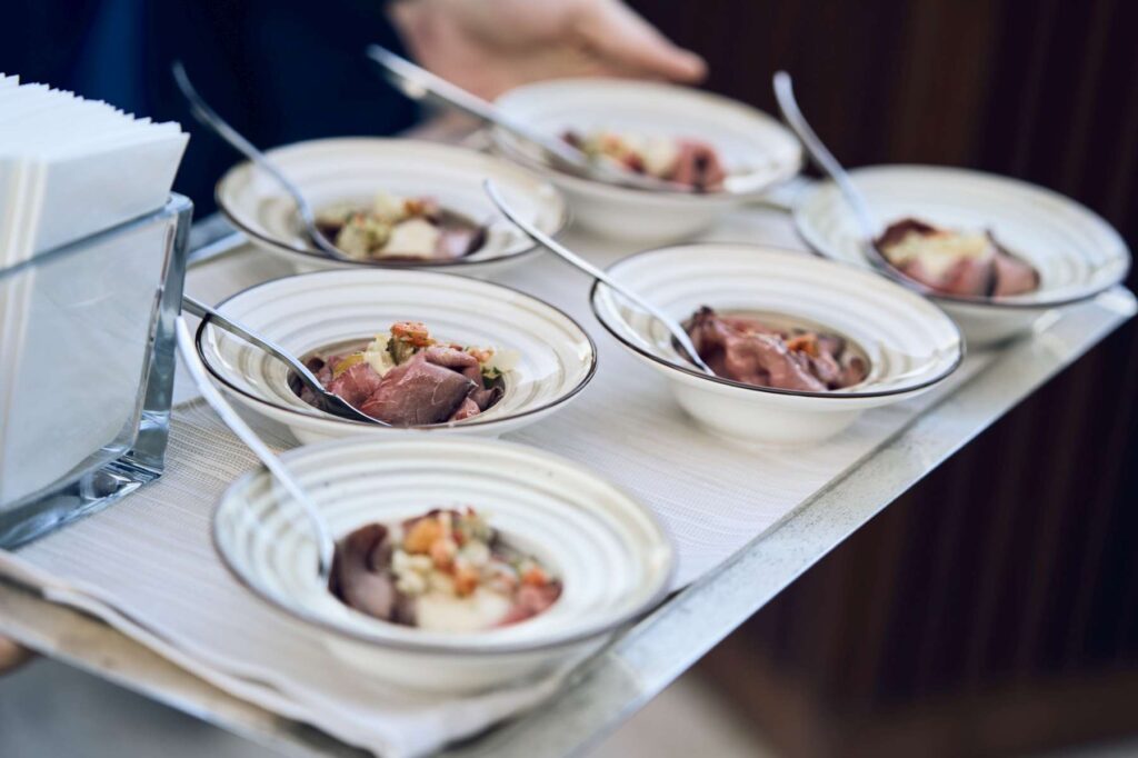 3. Serve Food with Plastic-Free Dinnerware<br>During the after-race refreshments, food and drinks were served using lower-impact disposable tableware, including biodegradable cellulose pulp plates, paper cups and wooden cutlery, avoiding conventional single-use plastic items.
For the social events, reusable tableware was used, including ceramic plates, glassware and metal cutlery, further reducing the use of disposable materials.