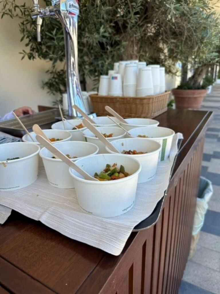 3. Serve Food with Plastic-Free Dinnerware<br>During the after-race refreshments, food and drinks were served using lower-impact disposable tableware, including biodegradable cellulose pulp plates, paper cups and wooden cutlery, avoiding conventional single-use plastic items.
For the social events, reusable tableware was used, including ceramic plates, glassware and metal cutlery, further reducing the use of disposable materials.