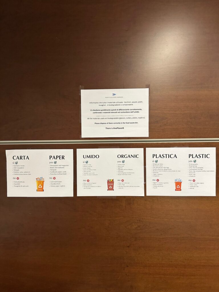 8. Post Educational and Reusable Signage<br>Bins and information on how to differentiate have been placed in the media room and media centre, each with a sign clearly indicating what type of waste should be put in them.
Next to the drinking water fountain is a noticeboard displaying statistics that prompt reflection on sustainability: the average number of litres of water consumed per day in Europe, the average daily consumption in Italy, the tonnes of plastic that end up in the Mediterranean Sea every year, and the number of animal species affected by pollution.