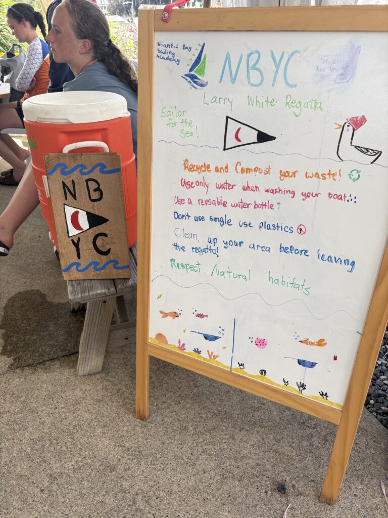 6. Publicize Your Sustainability Efforts<br>Jennifer Stivrins and Olivia Murin posted several clean regatta tips and practices through social media. All participants were required to sign the Sailor for the Sea Pledge. The Sailors for the Sea flag was raised for the day. Olivia Murin and Kennedy Nemec, our Green Team teen ambassadors, created a great sign on our white board as well.