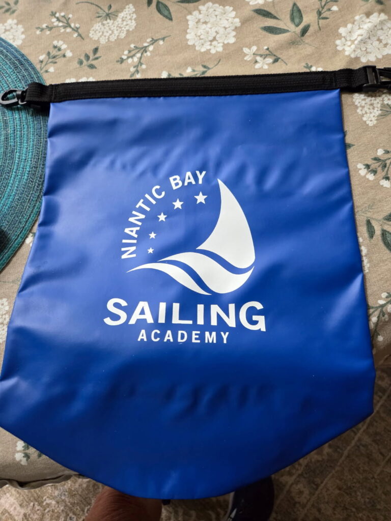 5. Award Practical Items or Use a Perpetual or Upcycled Trophy<br>The prize for first, second, and third place in all classes was a hat and reusable dry bag. 