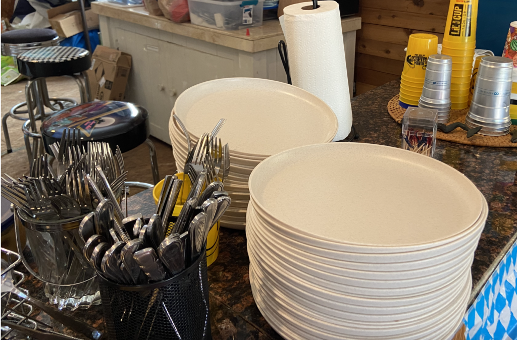 3. Serve Food with Plastic-Free Dinnerware<br>We use real silverware and reusable plates, bowls and cups. We take them home to wash (no running water at our clubhouse).